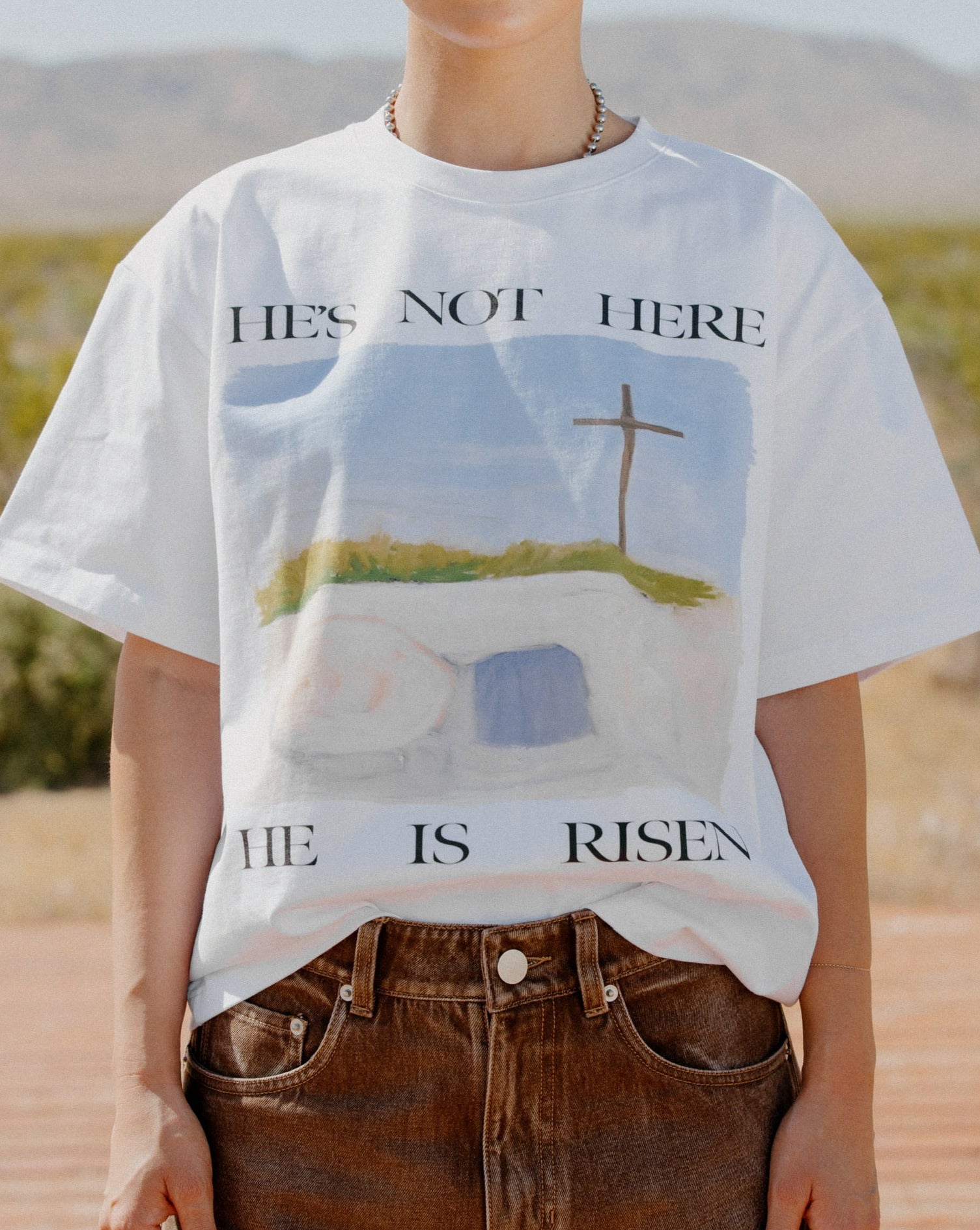 "HE'S NOT HERE" TEE